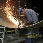 Man using a metal cutter without hearing protection