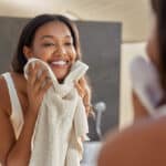 Woman washing face during morning skin care.jpg