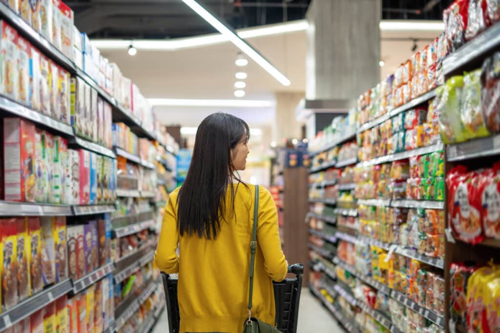 Customer buying groceries in supermarket